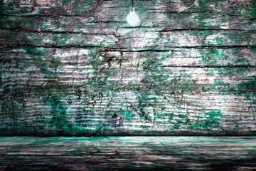 Hanging Light Bulb in the Empty Concrete Room 