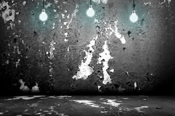 Hanging Light Bulb in the Empty Concrete Room 