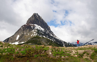 Lost Woman with binoculars looking for mountain