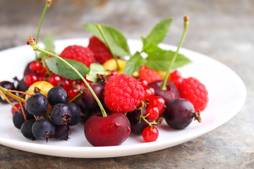 Concept of healthy vegan dessert, raspberry, cherry, red currant. Selective focus