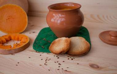 Vegetarian cream soup from a pumpkin with toasts