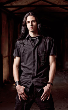 Portrait of handsome young man with long hair