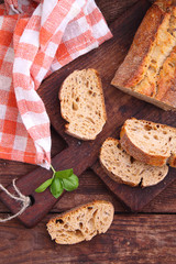 bread slices on a wooden board on a dark background