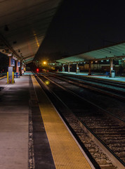 Fototapeta na wymiar Platform and ramp in Train Station at night