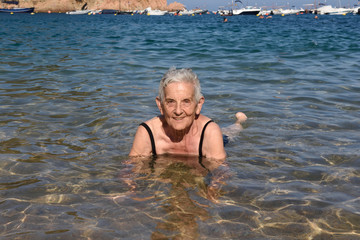 Senior woman enjoying the beach