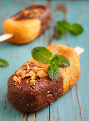 sponge cake in a black plate decorated with mint