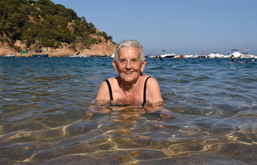 Portrait of a senior woman in the sea