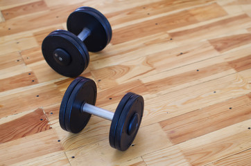 dumbbells on a floor in the gym