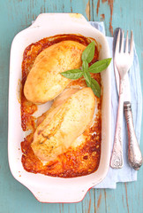 Baked breast of chicken in the white dish