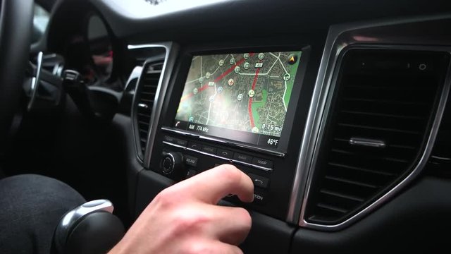 man uses a navigator in the car.