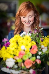 Naklejka premium Female florist standing and smiling