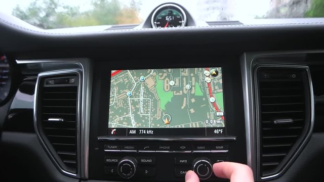 man uses a gps navigator in the car.