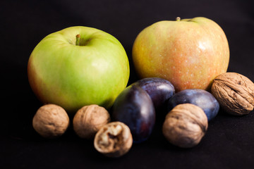 apple and plum and walnuts