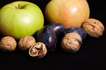 apple and plum and walnuts