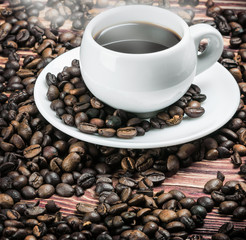 roasted coffee beans and a cup