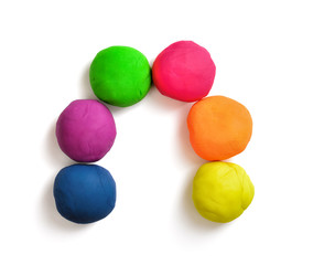 Arch made with colorful balls of modelling clay isolated on white background