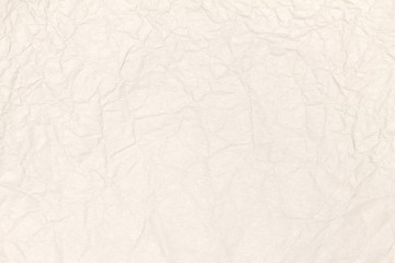 Recycled crumpled light brown paper texture or paper background for design with copy space for text or image.