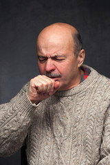 Elderly man is ill from colds or pneumonia. Suffering from flu virus.