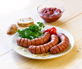 sausage and vegetables served on a wooden board for copy space