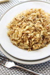 Fried cabbage with caraway and garlic on a plate