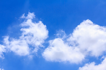 Blue sky background with white clouds. The vast blue sky and clouds sky on sunny day. White fluffy clouds in the blue sky.