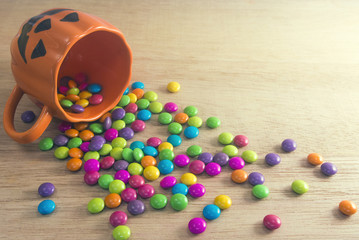 cup and candy on wood ground