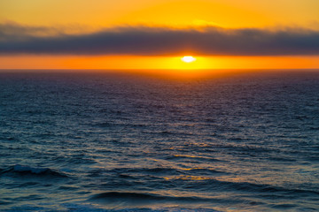 Cloudy sunset over ocean near Cascais, Portugal