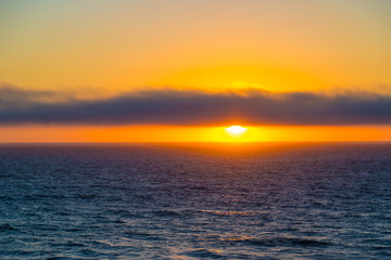 Cloudy sunset over ocean near Cascais, Portugal