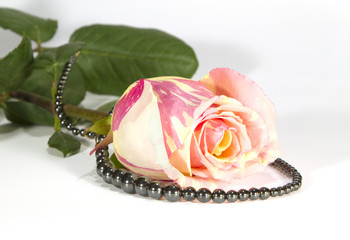 Bud of a gentle rose and  hematite beads