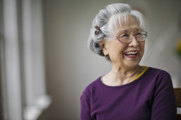 Portrait of a smiling senior woman at a doctor's office.