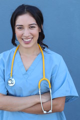 Attractive Female Hispanic Doctor or Nurse Isolated on a Blue Background.