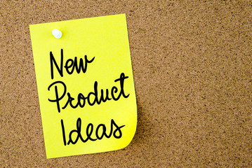 New Product Ideas text written on yellow paper note