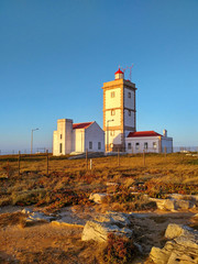 Fototapeta na wymiar Peniche lighthouse near Cabo Carvoeiro in sunset light