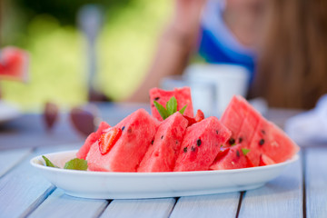 Watermelon slices on a plate at lunch time
