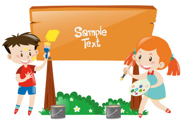 Boy and girl painting wooden sign