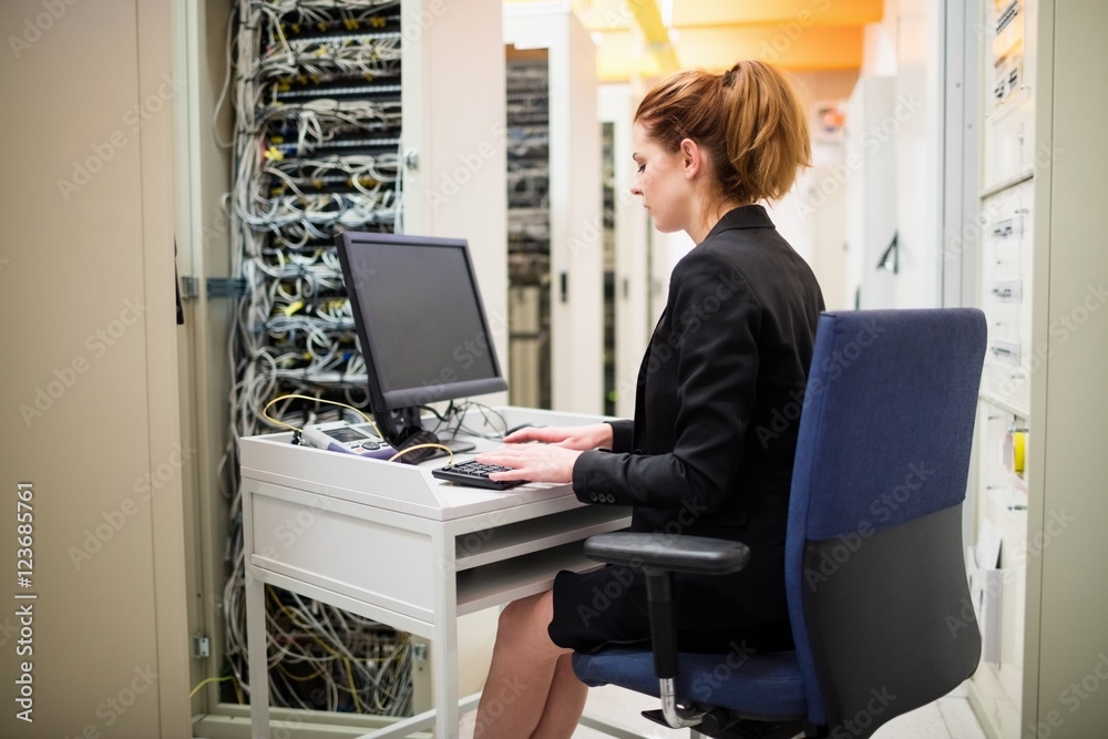 Poster Technician working on computer