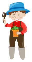 Gardener holding potted plant and fork