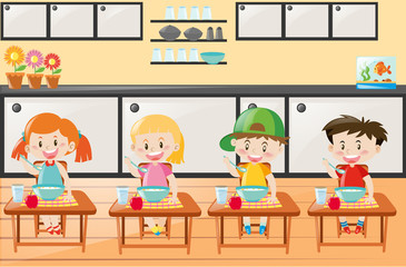 Four kids eating in the kitchen