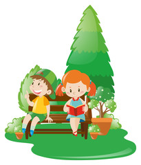 Boy and girl relaxing in park