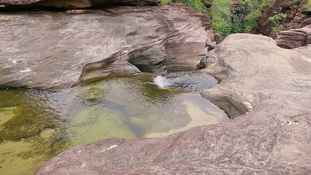 White Water flowing in over rocks river at thailand