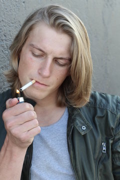 Young Man lighting a Cigarette closeup