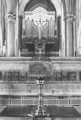 Brass Lectern with blurred Organ in Wells Cathedral BW