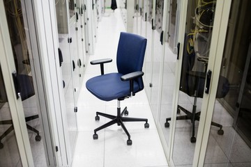 Empty chair in corridor