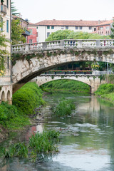 Fototapeta na wymiar View of the old Saint Michele stone bridge in Vicenza, Italy