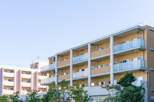 Residence image, apartment building against blue sky