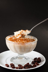 Rice pudding with cinnamon garnished.