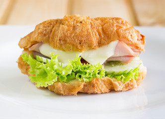 Croissant sandwich and cheese, ham with vegetable delicious brea