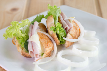 Croissant sandwich and cheese, ham with vegetable delicious brea