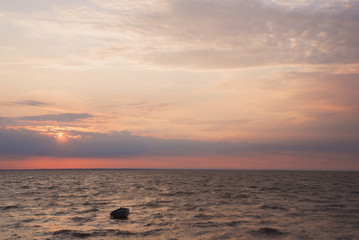Fototapeta na wymiar the boat into the sea at sunset