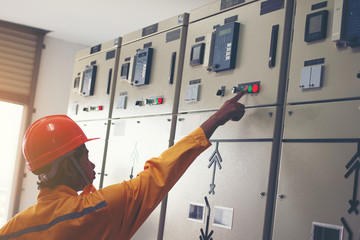 engineer working on checking and maintenance equipment : checking switchgear